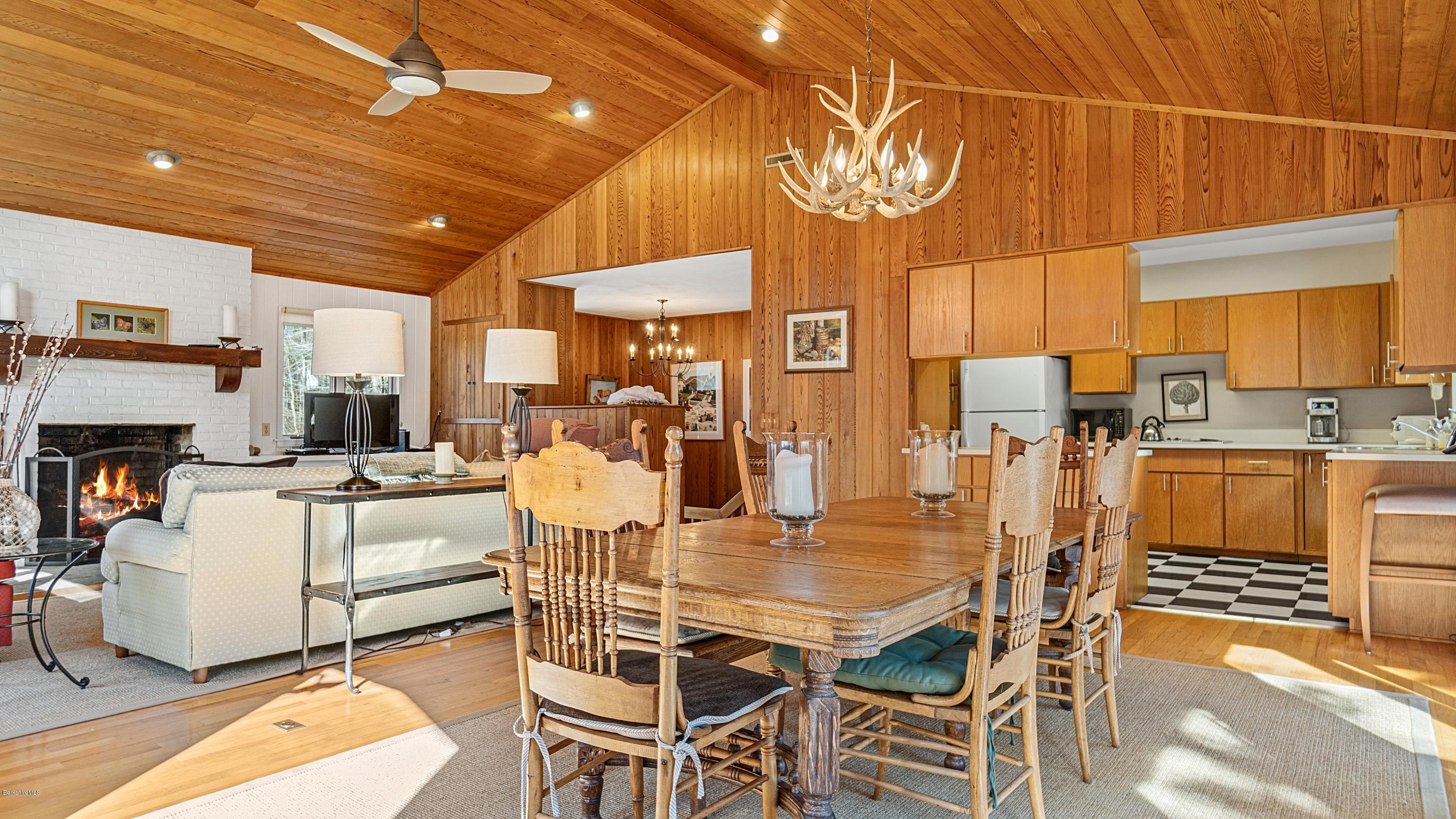 23 Interlaken Road Stockbridge, MA 01266 - Photo 7 of 26 a dining room with furniture and a kitchen view