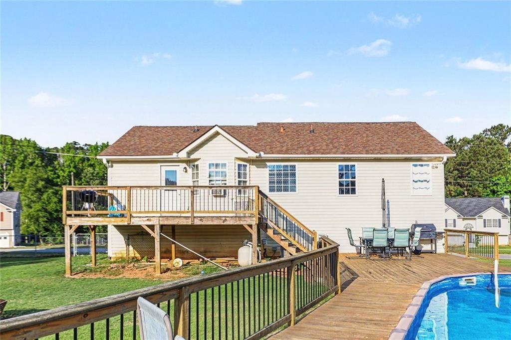 302 Fairview Lane Dallas, GA 30157 - Photo 24 of 26 a view of a house with wooden deck and furniture