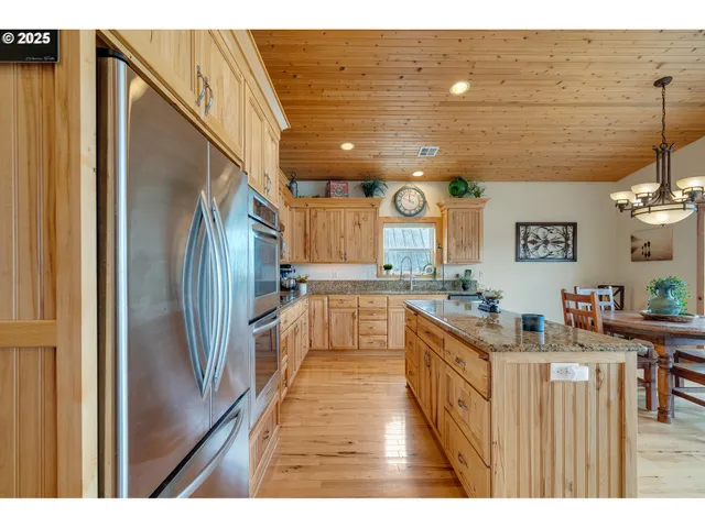 a kitchen with counter top space and stainless steel appliances