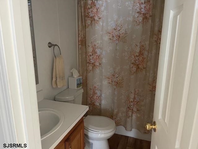 94 Center Ocean View, NJ 08230 - Photo 11 of 12 a bathroom with a sink and toilet