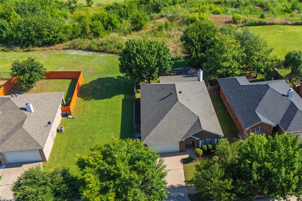 4025 Chisos Rim Trail Fort Worth, TX 76244 - Photo 40 of 40 Single-story residence featuring a gray shingle roof and brick exterior