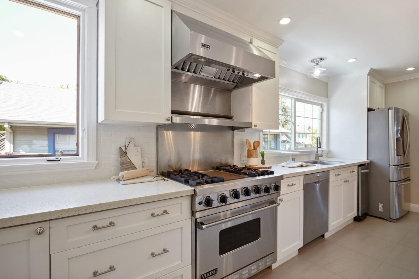 29 Bloomfield Road Burlingame, CA 94010 - Photo 18 of 54 a kitchen with stainless steel appliances granite countertop a stove a sink and a refrigerator