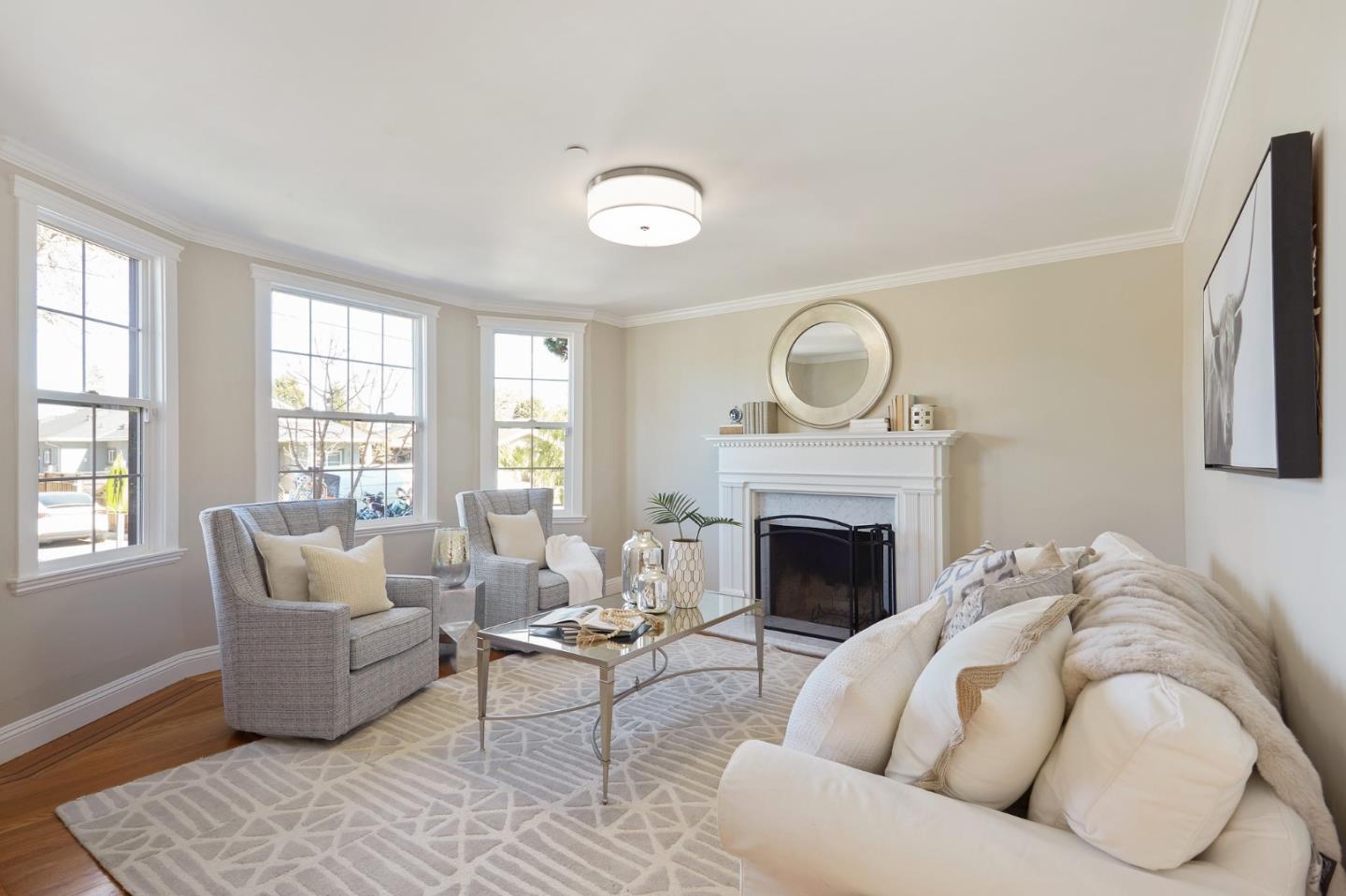 29 Bloomfield Road Burlingame, CA 94010 - Photo 23 of 54 a living room with furniture and a fireplace