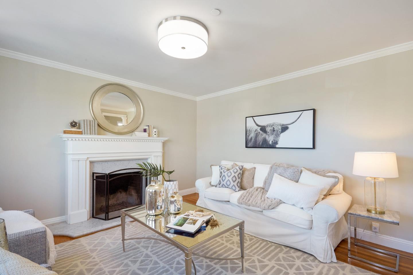 29 Bloomfield Road Burlingame, CA 94010 - Photo 24 of 54 a living room with furniture a fireplace and a lamp