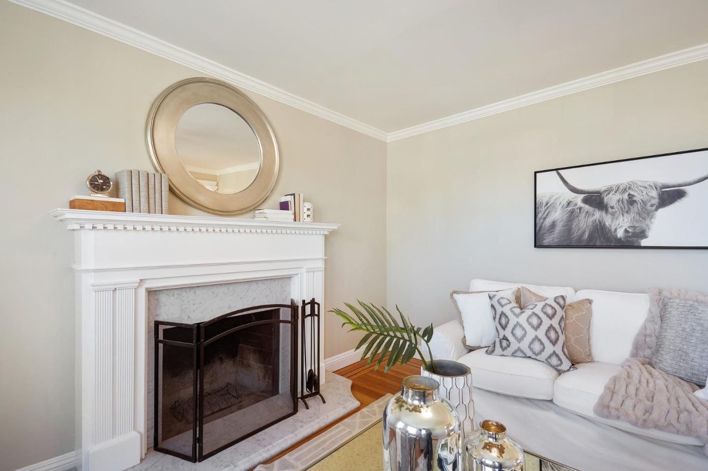 29 Bloomfield Road Burlingame, CA 94010 - Photo 25 of 54 a living room with furniture a mirror and a fireplace
