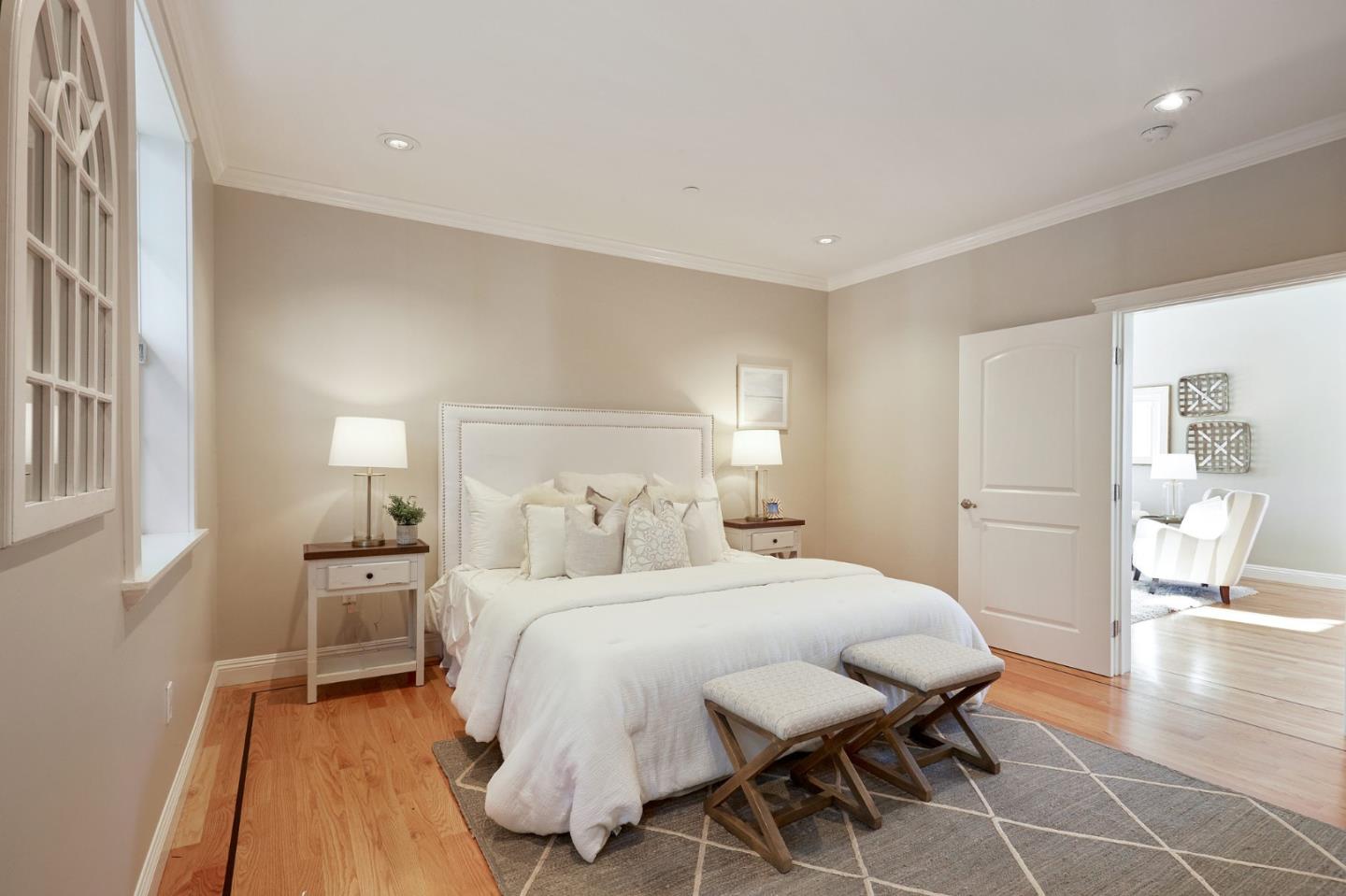 29 Bloomfield Road Burlingame, CA 94010 - Photo 29 of 54 a bedroom with a bed and wooden floor