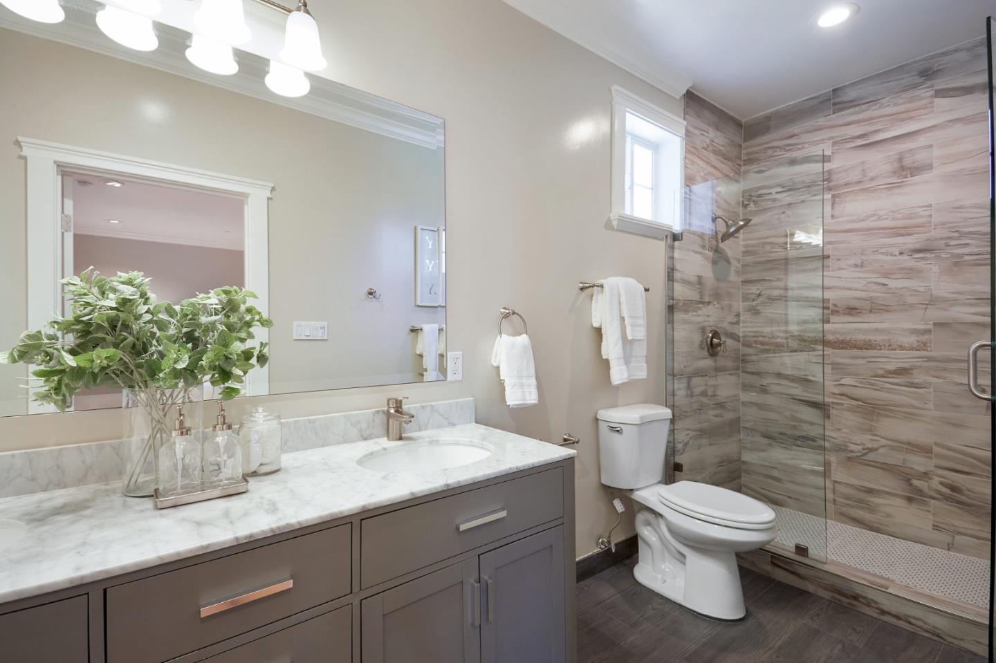 29 Bloomfield Road Burlingame, CA 94010 - Photo 31 of 54 a bathroom with a granite countertop toilet sink and mirror