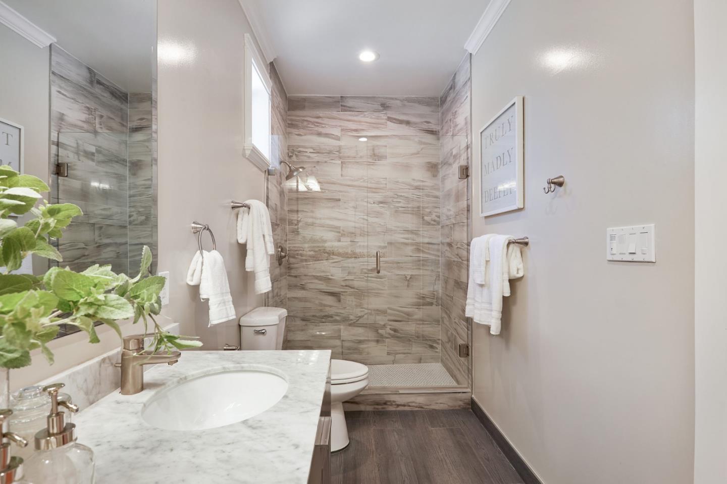 29 Bloomfield Road Burlingame, CA 94010 - Photo 33 of 54 a bathroom with a granite countertop sink a toilet and shower