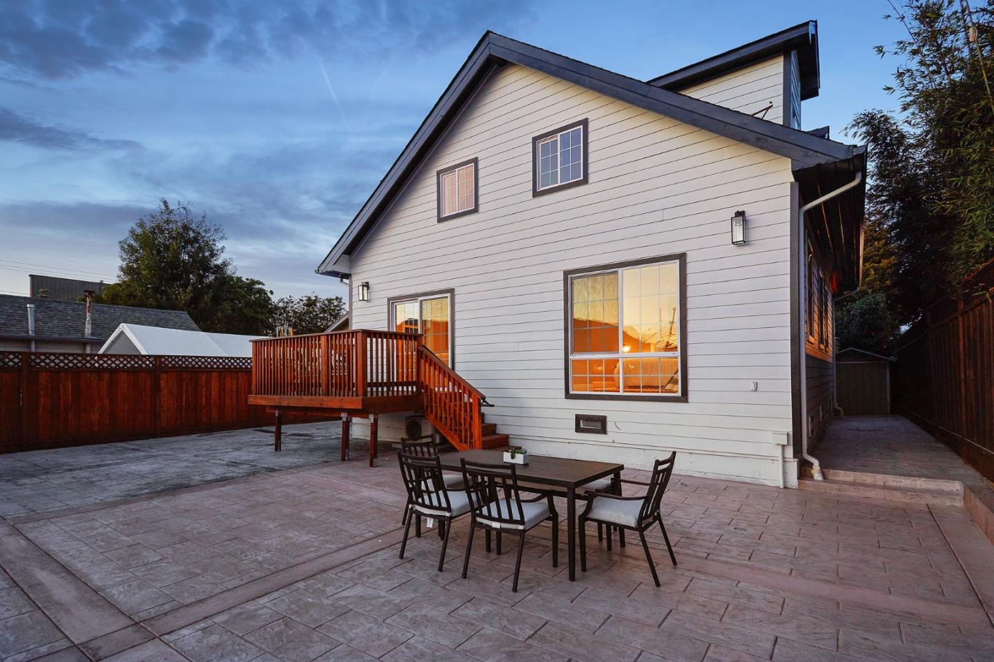 29 Bloomfield Road Burlingame, CA 94010 - Photo 52 of 54 a backyard of a house with wooden table and chairs
