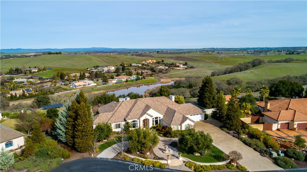 an aerial view of residential building and lake