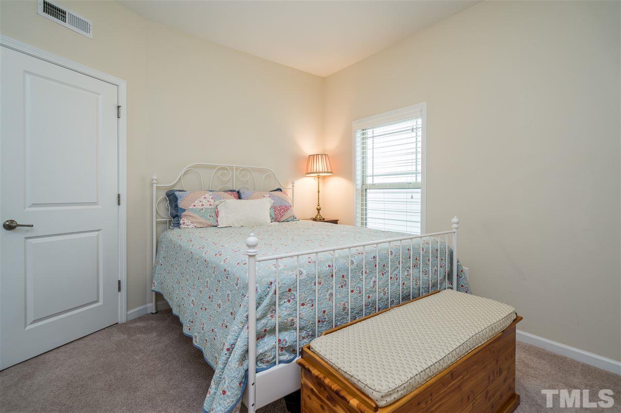 5630 Wade Park Boulevard Raleigh, NC 27607 - Photo 21 of 30 Neutral paint and carpet and ready to move in to this upstairs secondary bedroom with shared hall bath!