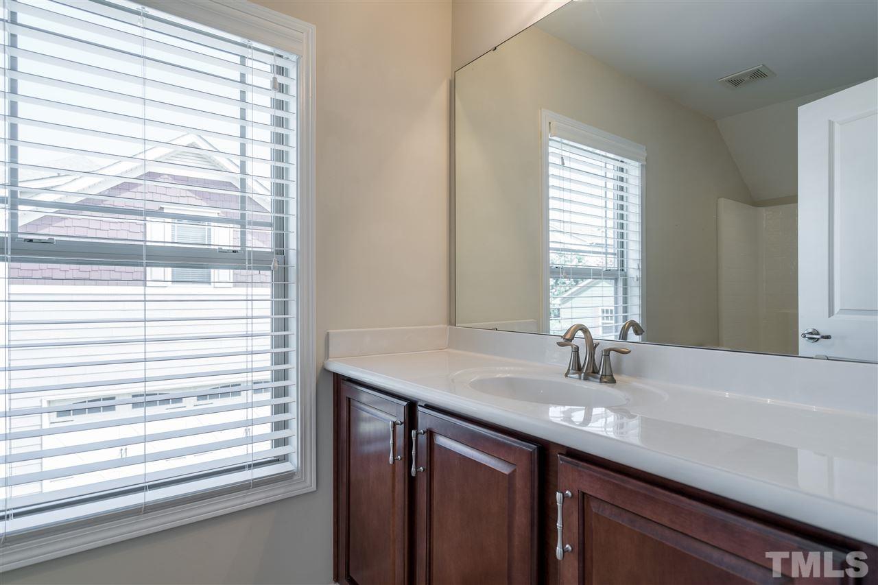 5630 Wade Park Boulevard Raleigh, NC 27607 - Photo 27 of 30 Full bathroom in garage suite. Tub/shower combo, coordinating cabinets with the house and all you could need!