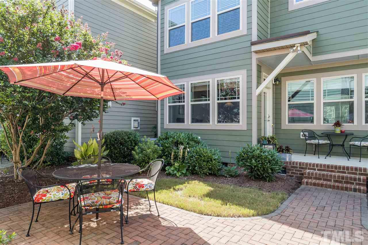 5630 Wade Park Boulevard Raleigh, NC 27607 - Photo 28 of 30 Brick paver patio perfect for furniture, mature landscaping and HOA maintaining the yard---great combination for relaxing!