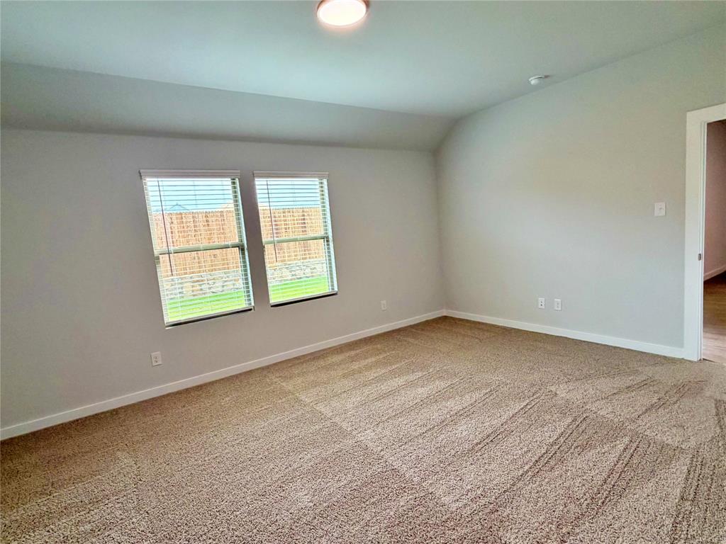 2203 Heatwave Lane Princeton, TX 75407 - Photo 13 of 32 an empty room with a window
