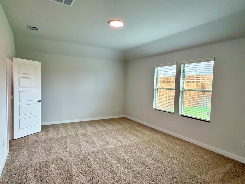 2203 Heatwave Lane Princeton, TX 75407 - Photo 16 of 32 an empty room with a window