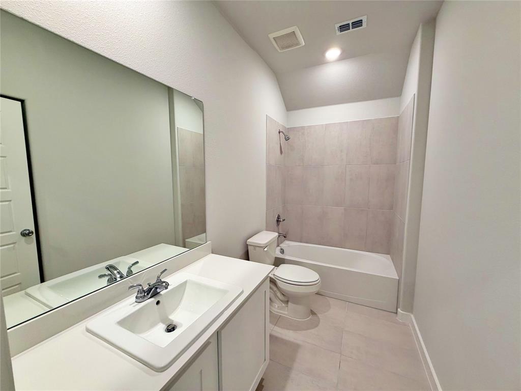 2203 Heatwave Lane Princeton, TX 75407 - Photo 18 of 32 a bathroom with a sink toilet tub and shower