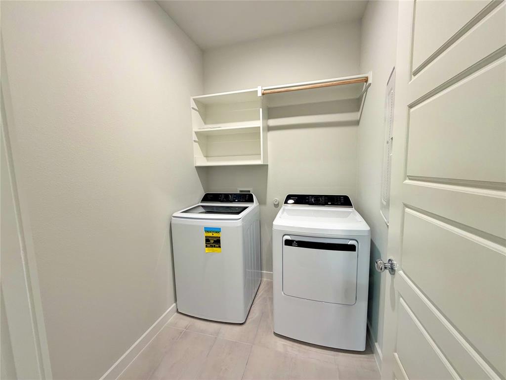 2203 Heatwave Lane Princeton, TX 75407 - Photo 24 of 32 a utility room with dryer and washer