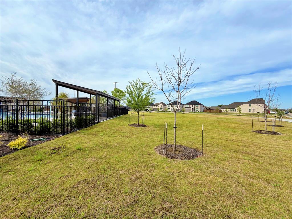 2203 Heatwave Lane Princeton, TX 75407 - Photo 31 of 32 a backyard of a building