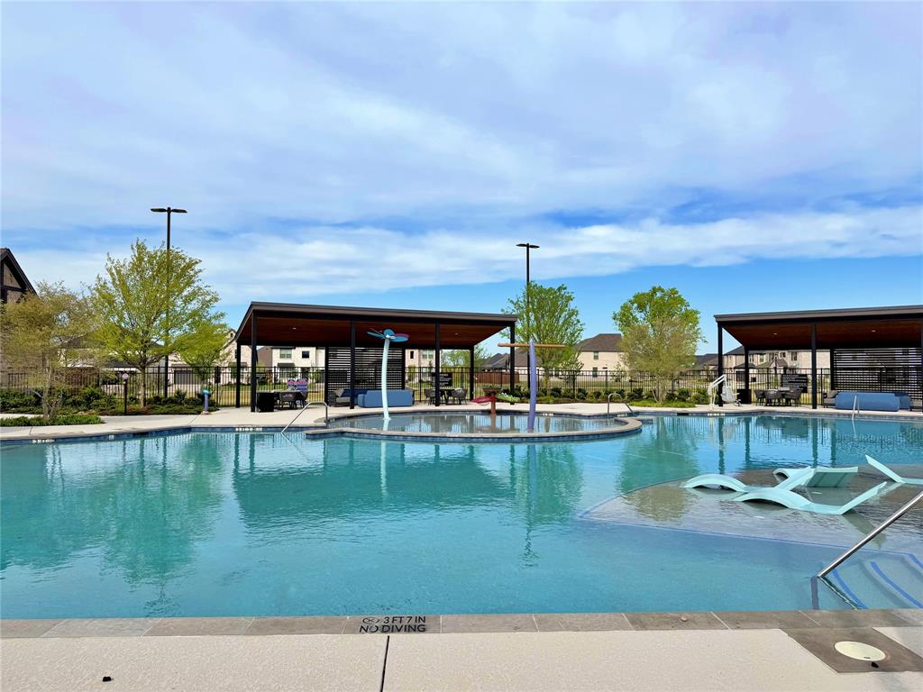 2203 Heatwave Lane Princeton, TX 75407 - Photo 32 of 32 a view of a swimming pool with outdoor seating
