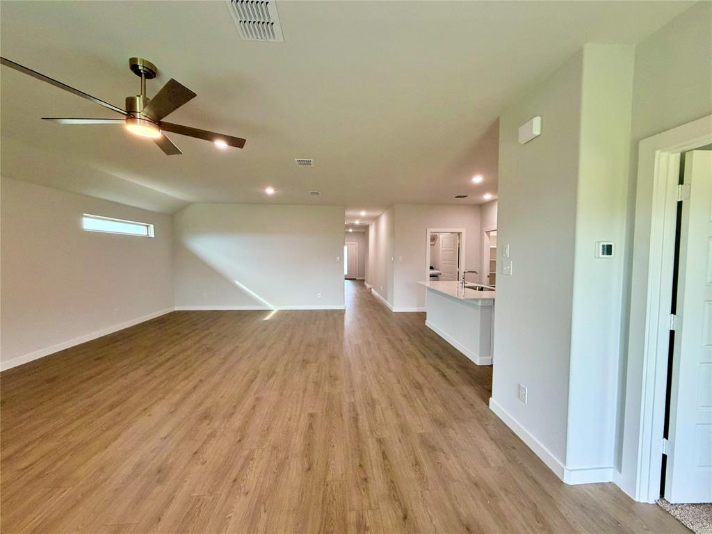 2203 Heatwave Lane Princeton, TX 75407 - Photo 5 of 32 a view of a hallway with wooden floor