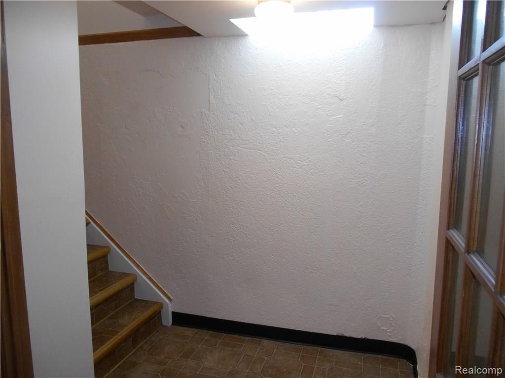 25754 Peter Kaltz Road Warren, MI 48091 - Photo 58 of 68 SPACIOUS LANDING AT THE BOTTOM OF THE BASEMENT STAIRWAY