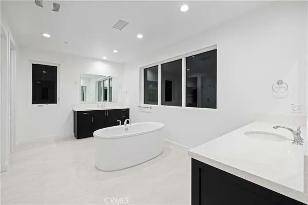 a bathroom with a sink double vanity and a mirror