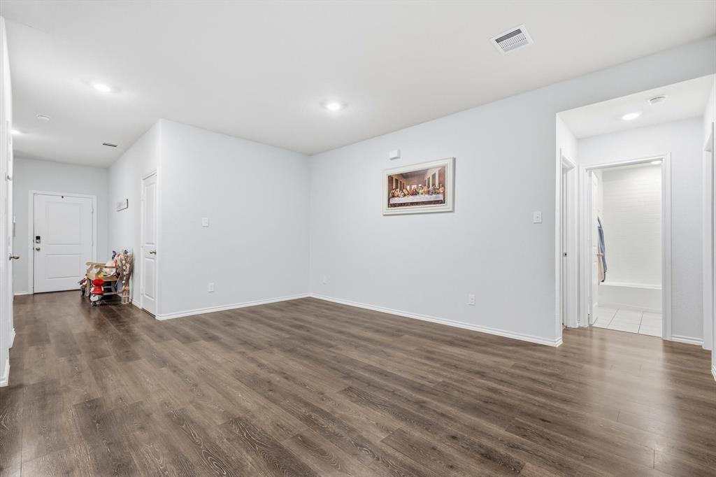 2416 Wildhaven Road Crandall, TX 75114 - Photo 11 of 35 a view of a livingroom with wooden floor