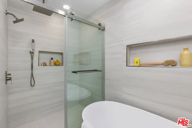 a bathroom with a sink and shower