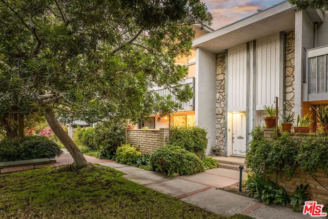 a view of a swimming pool with chairs
