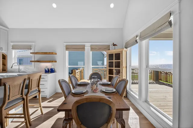 a view of a dining room with furniture window and outside view