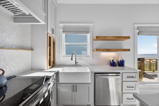 a kitchen with a sink stove and refrigerator