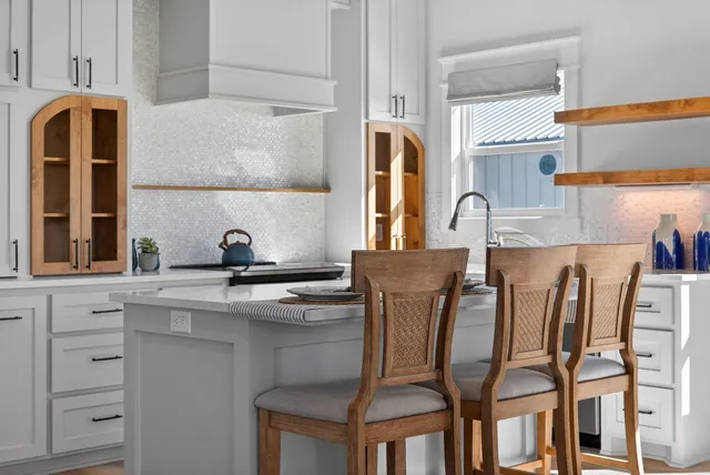 a table with chairs and a dining table with wooden floor