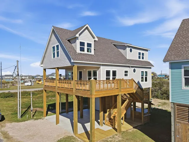 a front view of a house with a yard table and chairs