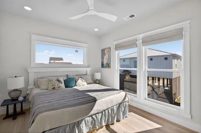 a bedroom with a large bed and a window