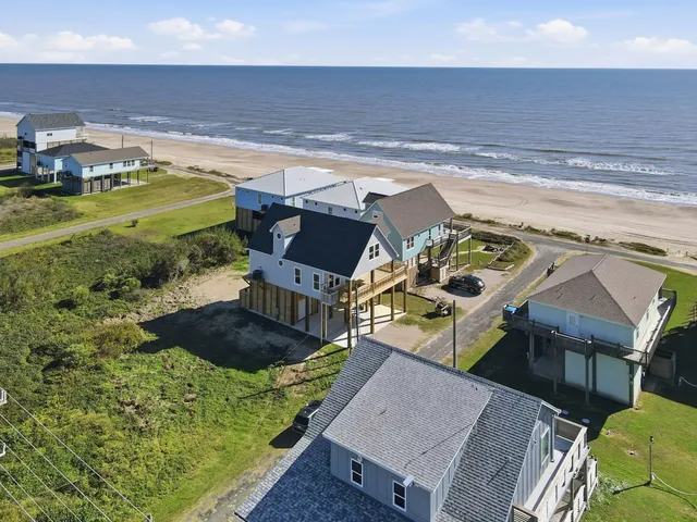 a view of a backyard with plants and yard