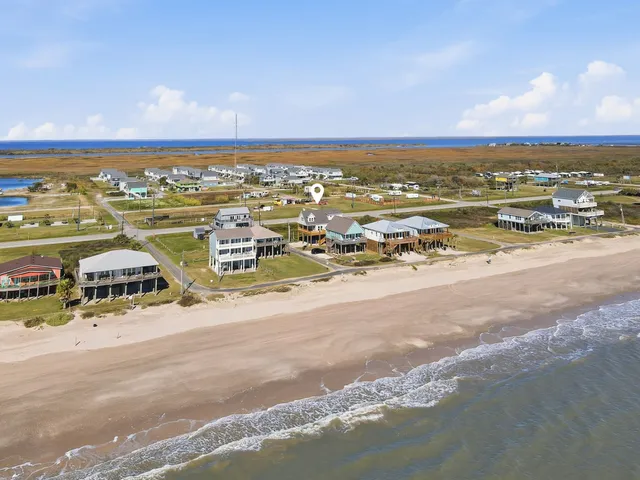 an aerial view of residential building with parking space