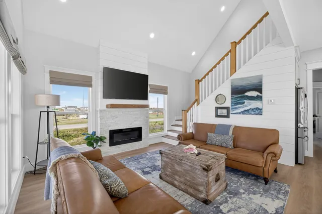 a living room with furniture fireplace and a flat screen tv