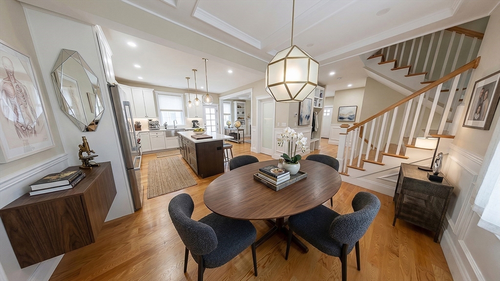 42 Parsons Street Newton, MA 02465 - Photo 13 of 36 a view of a dining room with furniture window and wooden floor
