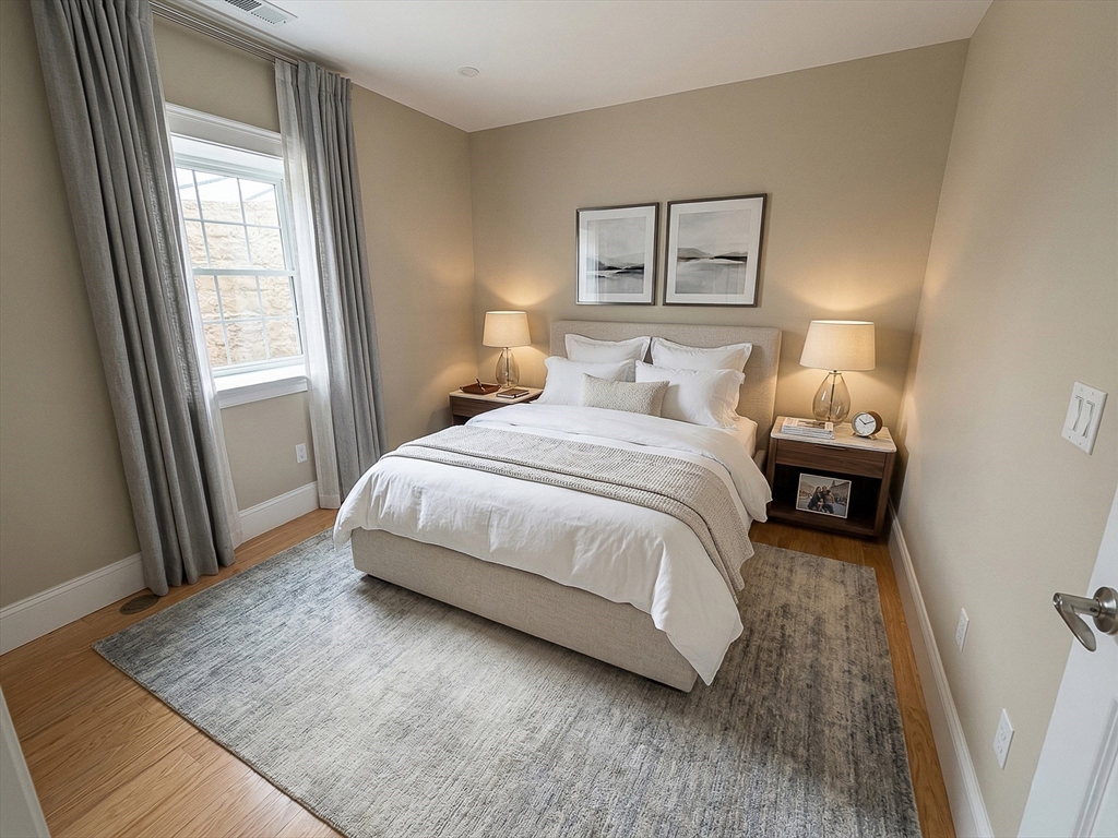 42 Parsons Street Newton, MA 02465 - Photo 14 of 36 a bedroom with a bed and a window