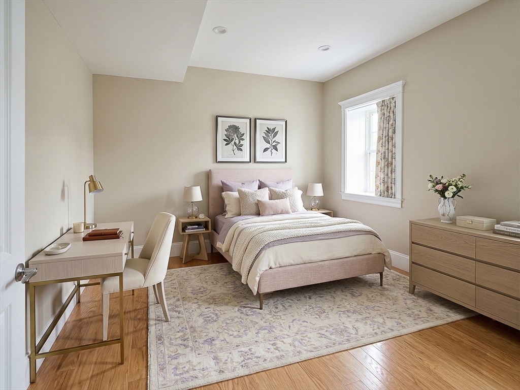 42 Parsons Street Newton, MA 02465 - Photo 15 of 36 a bedroom with a bed and a table