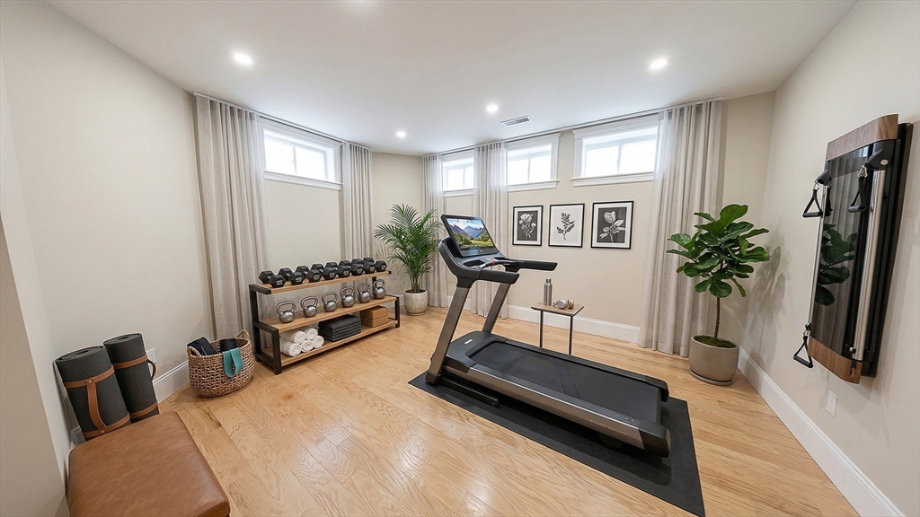 42 Parsons Street Newton, MA 02465 - Photo 17 of 36 a view of a room with gym equipment and a window