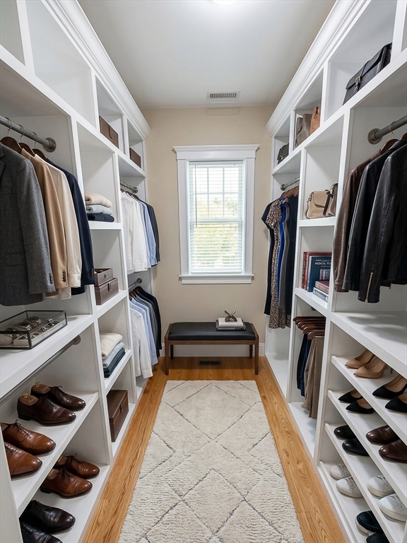 42 Parsons Street Newton, MA 02465 - Photo 19 of 36 a view of walk in closet with clothes and shoes