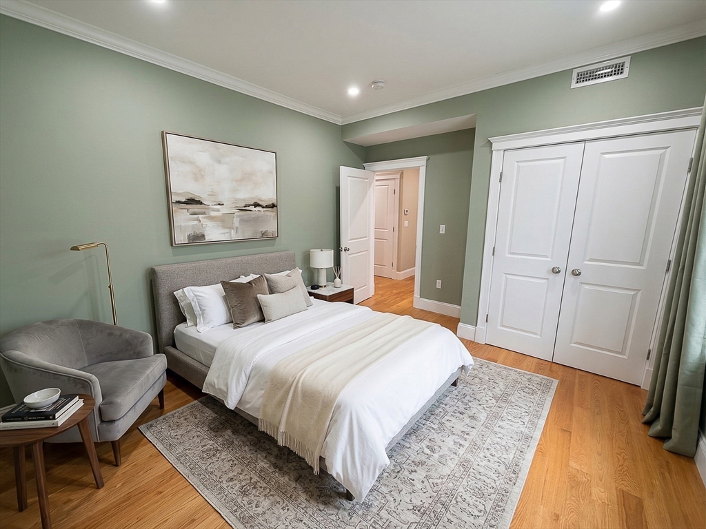 42 Parsons Street Newton, MA 02465 - Photo 27 of 36 a bedroom with a bed and a couch