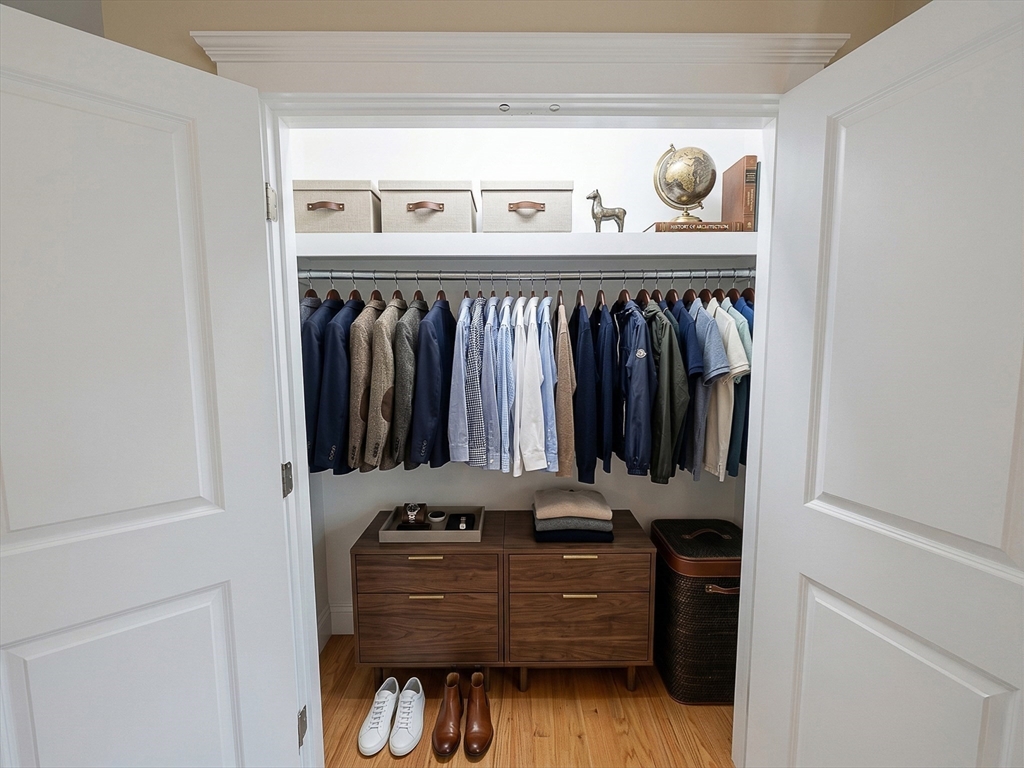 42 Parsons Street Newton, MA 02465 - Photo 28 of 36 a view of walk in closet with clothes and shoes