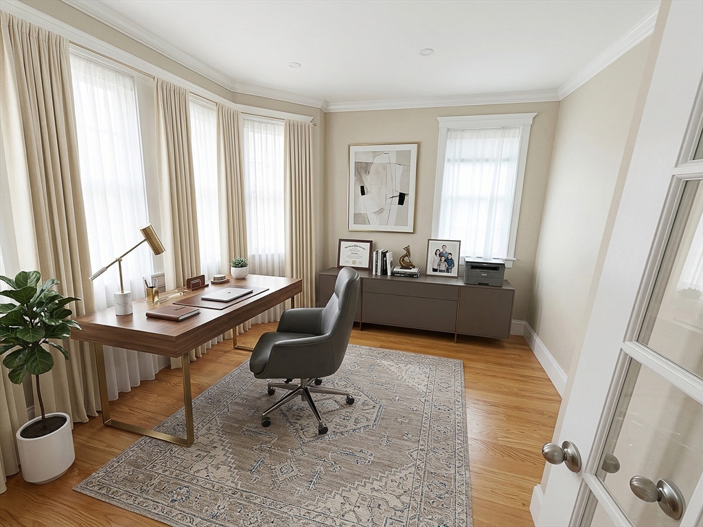 42 Parsons Street Newton, MA 02465 - Photo 5 of 36 a living room with furniture and a potted plant
