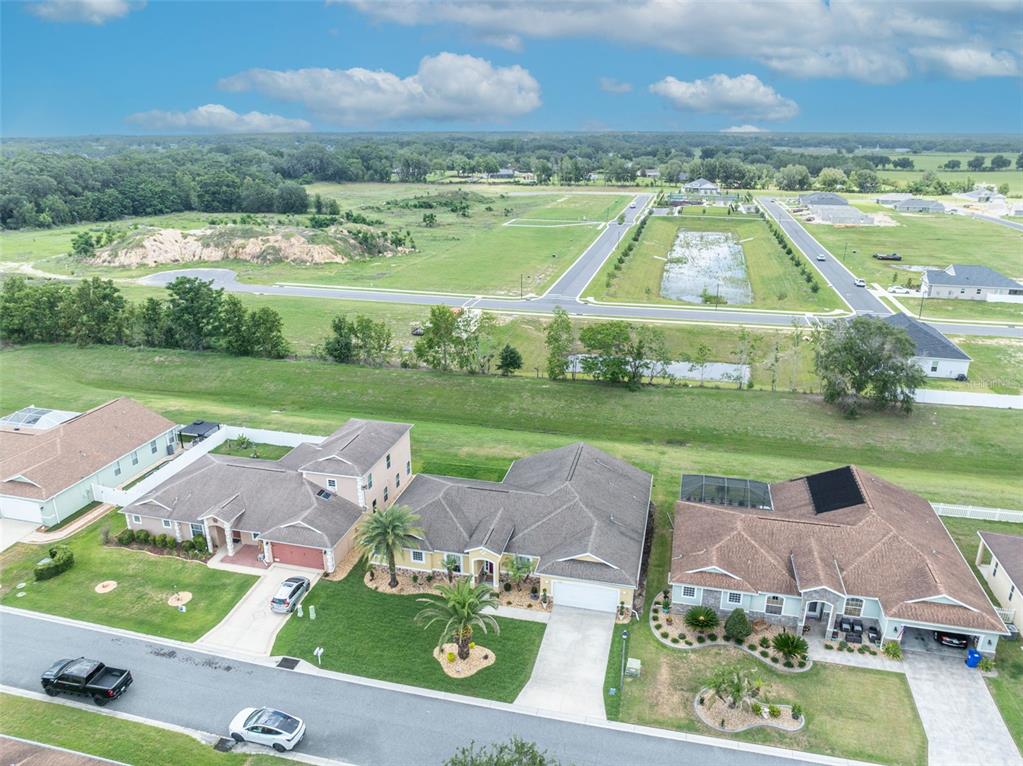 4946 Northeast 124th Road Oxford, FL 34484 - Photo 62 of 69 an aerial view of a house with garden space and street view