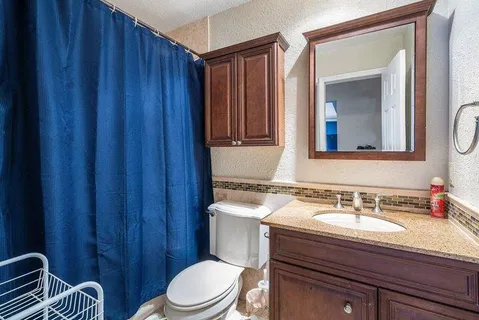 a bedroom with two beds and a window