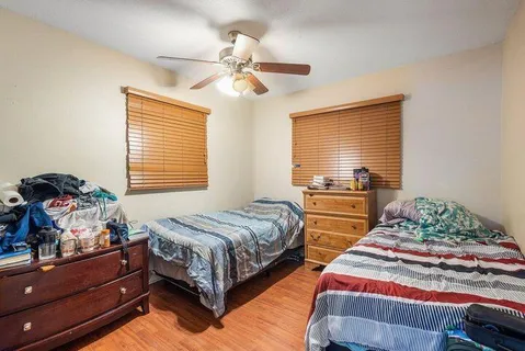a view of a livingroom with furniture and a potted plant