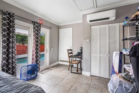 a bedroom with double bed and a window