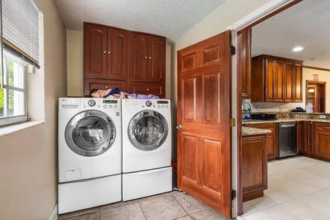 an aerial view of a house with yard swimming pool and outdoor seating